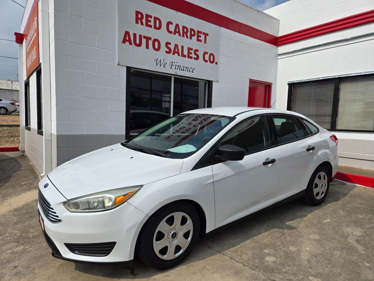 2016 WHITE Ford Focus S Sedan (1FADP3E2XGL) with an 2.0L L4 DOHC 16V engine, Automatic transmission, located at 503 West Court, Seguin, TX, 78155, (830) 379-3373, 29.568621, -97.969803 - Photo#0